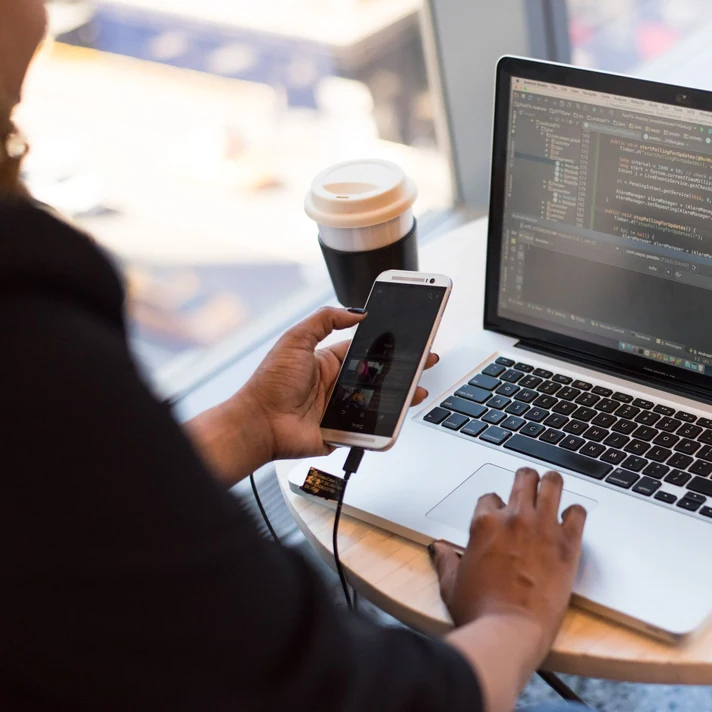 Person working with applications on a laptop computer