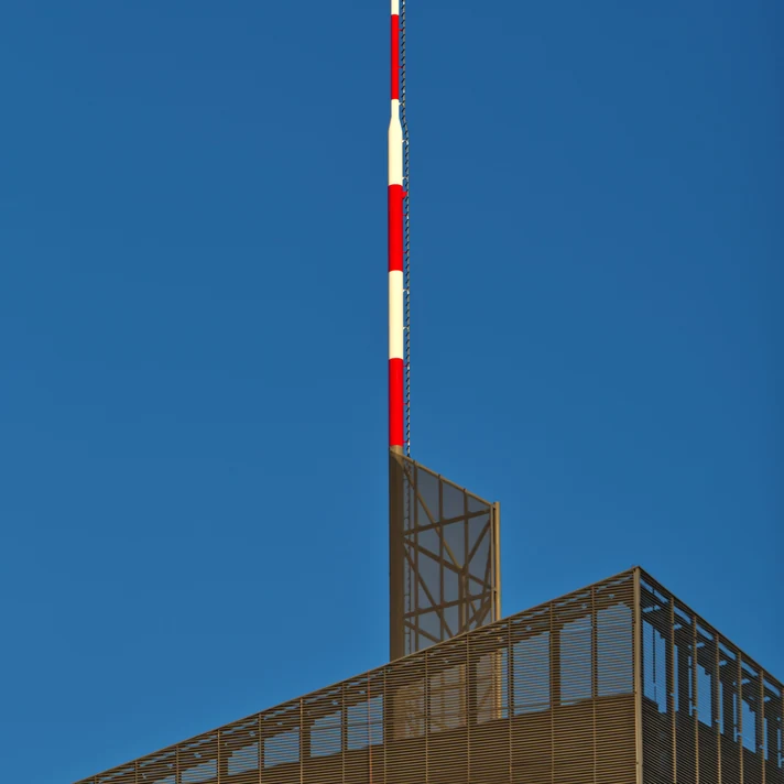 Telecommunications antenna against a blue sky
