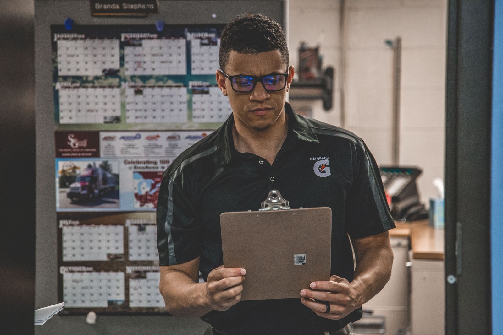 Supplier operations professional checking a clipboard