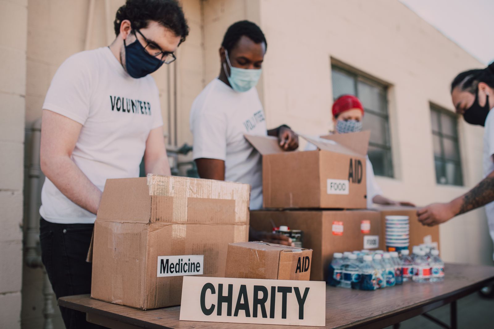Volunteers organising community donation boxes