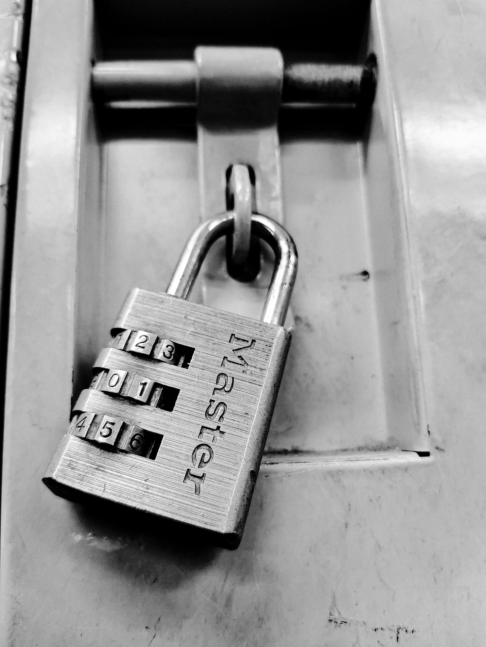 A combination lock illustrating controlled access by PIN