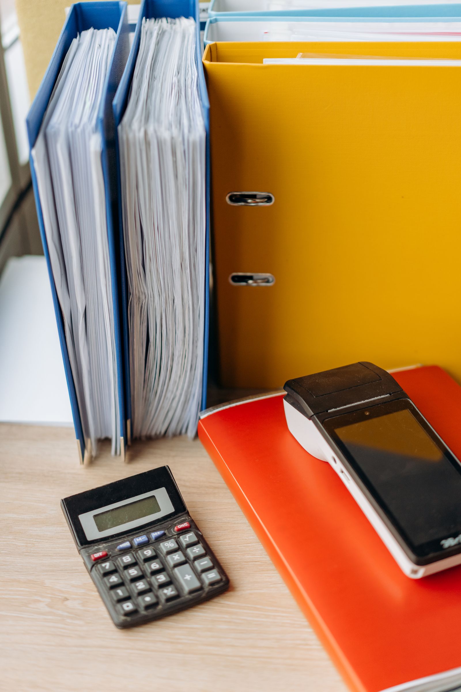 Calculator and financial documents arranged for accounting work