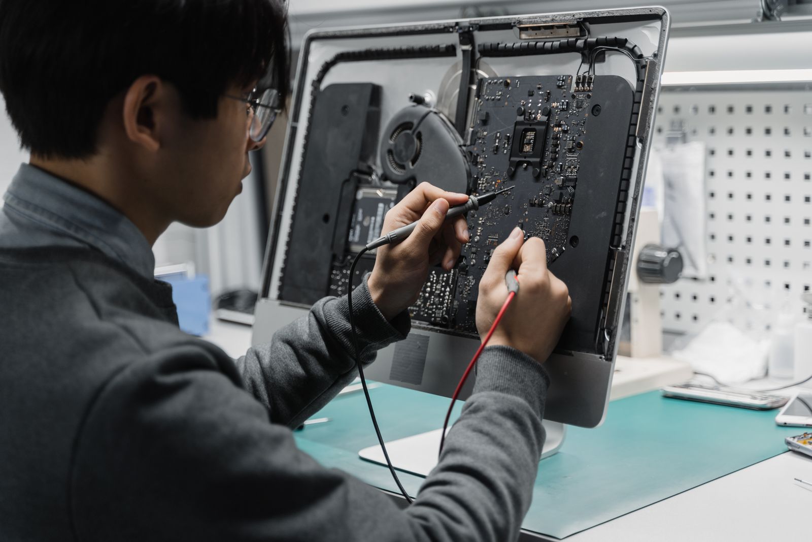 TIN Solutions computer hardware technician bench testing a motherboard
