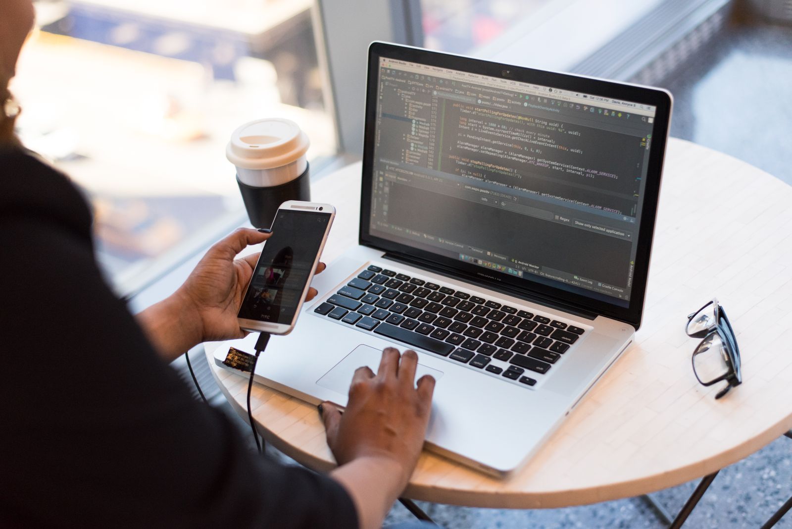 Person working with applications on a laptop computer